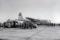 A crowd gathers around the YC-130 at the Air Force Flight Test Station at Edwards AFB, California, after the all-Lockheed crew completed the first flight on 23 August 1954. This aircraft was later used for engine test work at the Allison facility in Indianpolis, Indiana, and was scrapped in 1962.