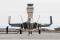 F-35C salutes with wingtips up in front of the control tower at Edwards AFB, California.