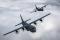 Two 37th Airlift Squadron C-130J Super Hercules crews practice formation flying in preparation for events in May 2014 commemorating the seventieth anniversary of D-Day. The 37th AS is based at Ramstein AB, Germany.