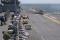 Distinguished visitors watch F-35B vertical takeoff and landing flight operations aboard the amphibious assault ship USS Wasp (LHD-1) during the first phase of shipboard operational testing.