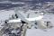 4. Over Wright-Patterson AFB, Ohio, 2005: “This was the last air-to-air photography ever done with of a C-141 StarLifter. It was the middle of December and the crew of the chase C-141 opened the petal doors in flight—the last time that happened—and we made several passes over the Air Force Museum to get the national insignia on the Hanoi Taxi’s wing to line up with the insignia painted on the museum building. We were in Dayton again in May for the last flight of this aircraft—and the last-ever flight of a C-141—when the Taxi was retired to the museum.”