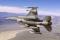 F-16 with Sniper pod flies over the ranges near Edwards AFB, California.